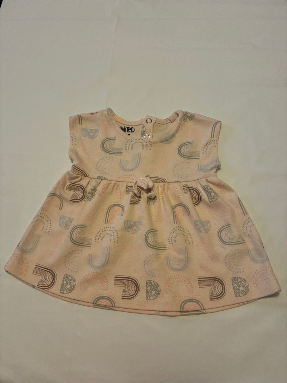 The Limited Pastel Rainbow Print Baby Dress in Pink